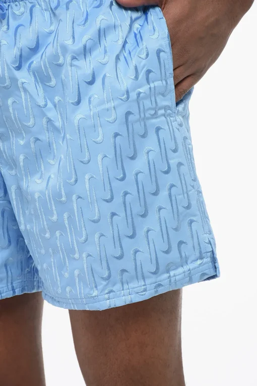 New SWIM Shorts in Tinta Unita con Logo Ricamato All-Over Uomo Pantaloni