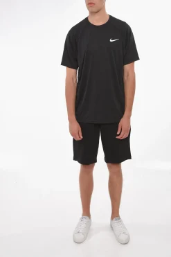 SWIM t-shirt DRI-FIT a Tinta Unita con Logo Stampato></noscript>Nike Hot